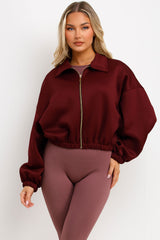 womens burgundy puffed bomber jacket with front double welt pockets zara womens uk 