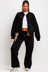 womens black tracksuit zip up sweatshirt joggers and baby tee 3 piece loungewear set styled up