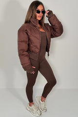 crop puffer jacket with thumbholes cinched waist alo yoga styledup uk