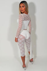 womens white lace trousers with drape detail 3/4 capri lace leggings festival outfit styledup fashion