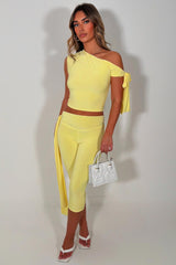 yellow capri pants with side drape detail and asymmetric neckline crop top two piece co ord set night out occasion outfit for womens 