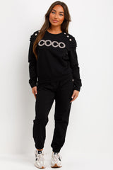 frill shoulder gold button top and trousers tracksuit set airport outfit