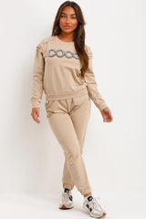 frill shoulder gold button top and trousers tracksuit set airport outfit