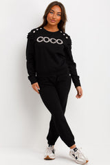 frill shoulder gold button coco diamante top and trousers two piece tracksuit set airport outfit