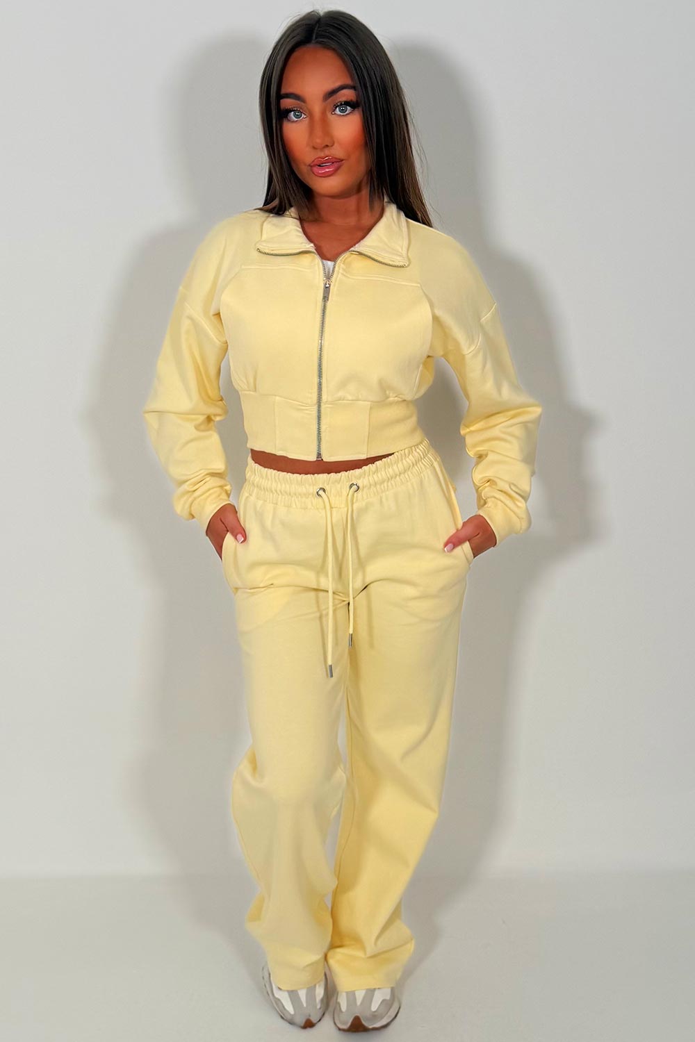 womens yellow crop sweatshirt and wide leg joggers tracksuit airport outfit casual everyday outfit styledup uk