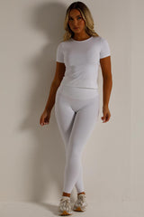 skims womens sports short sleeve top and leggings two piece set