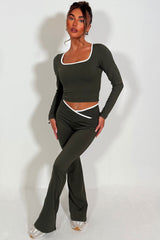long sleeve yoga top and high rise v waist flare yoga pants styled up 