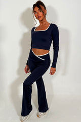 long sleeve yoga top and high rise v waist flare yoga pants styled up 