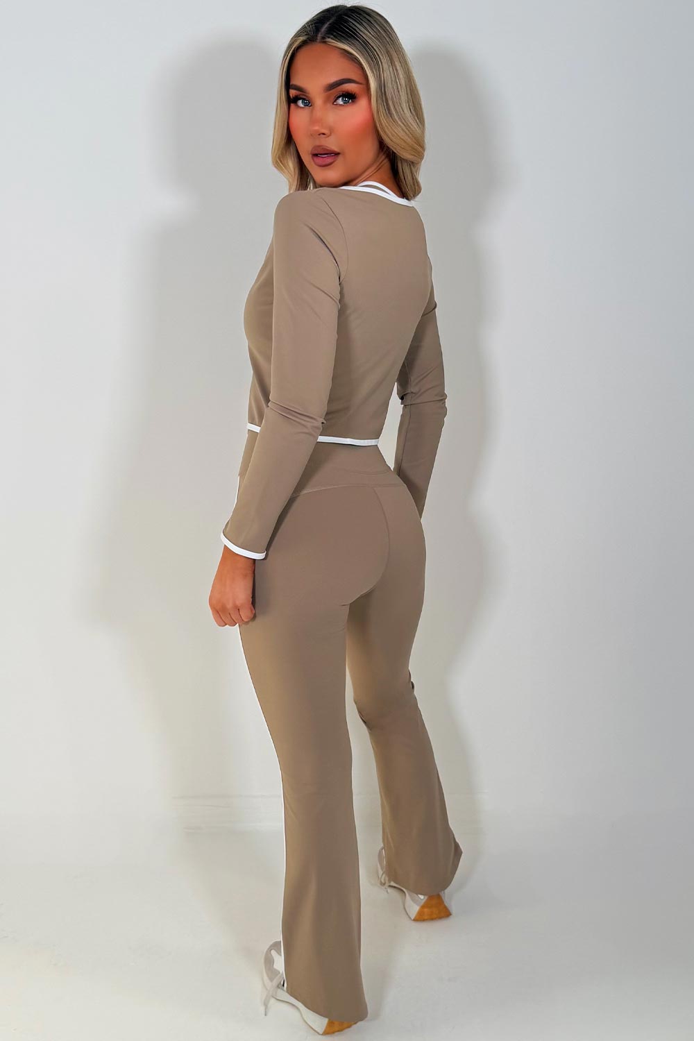 zip up sports jacket crop top and scrunch bum flare pants three piece set beige 