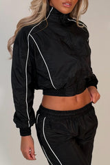 black crop funnel neck jacket and wide leg trousers tracksuit holiday festival rave outfit styledup uk