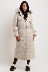 long puffer coat with fur hood and belt