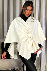 cream poncho cape with bow women's