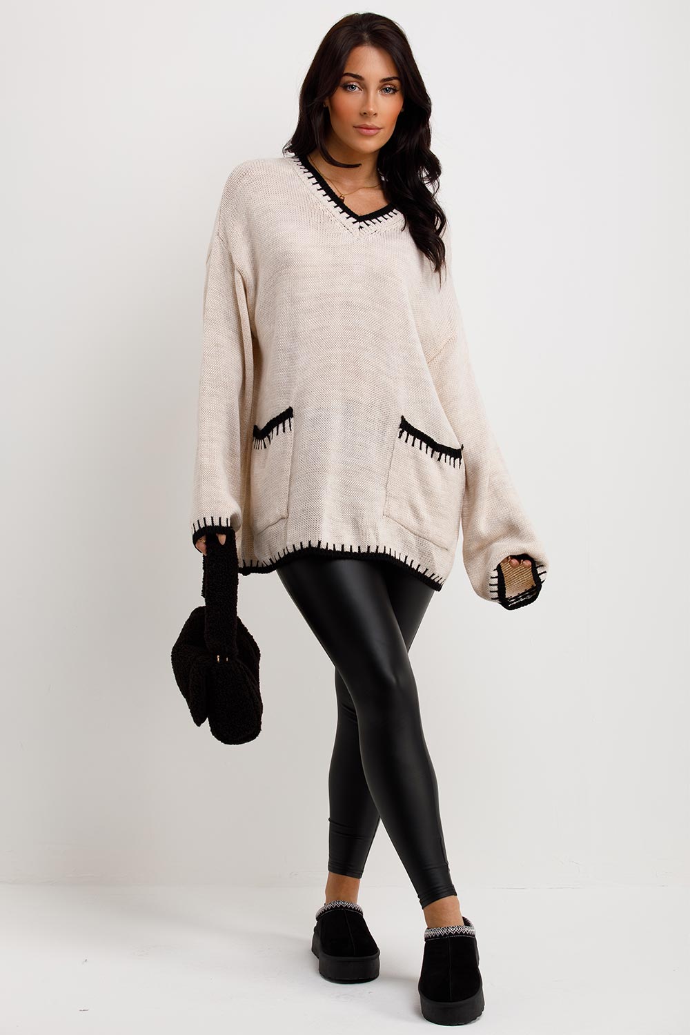 oversized knitted jumper with contrast stitchesand pockets