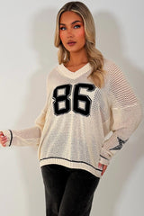 cream long sleeve knitted jumper with boston slogan styledup 