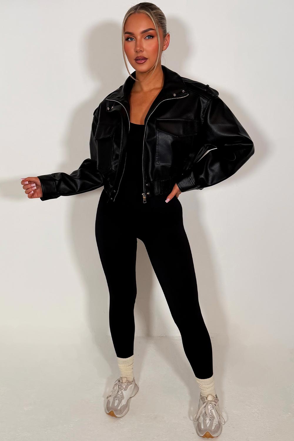 zara womens short jacket with high collar long sleeves shoulder tabs pockets on front black faux leather 