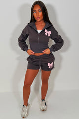 womens cinched waist crop corset hoodie and shorts tracksuit bow detail airport outfit co ord 