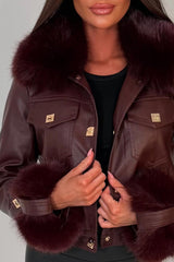 womens fur cuff and collar faux leather jacket with gold buttons styled up for christmas party night out outfit