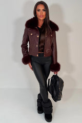 gold button faux leather bomber jacket with faux fur cuff and faux fur collar styled up womens outerwear 