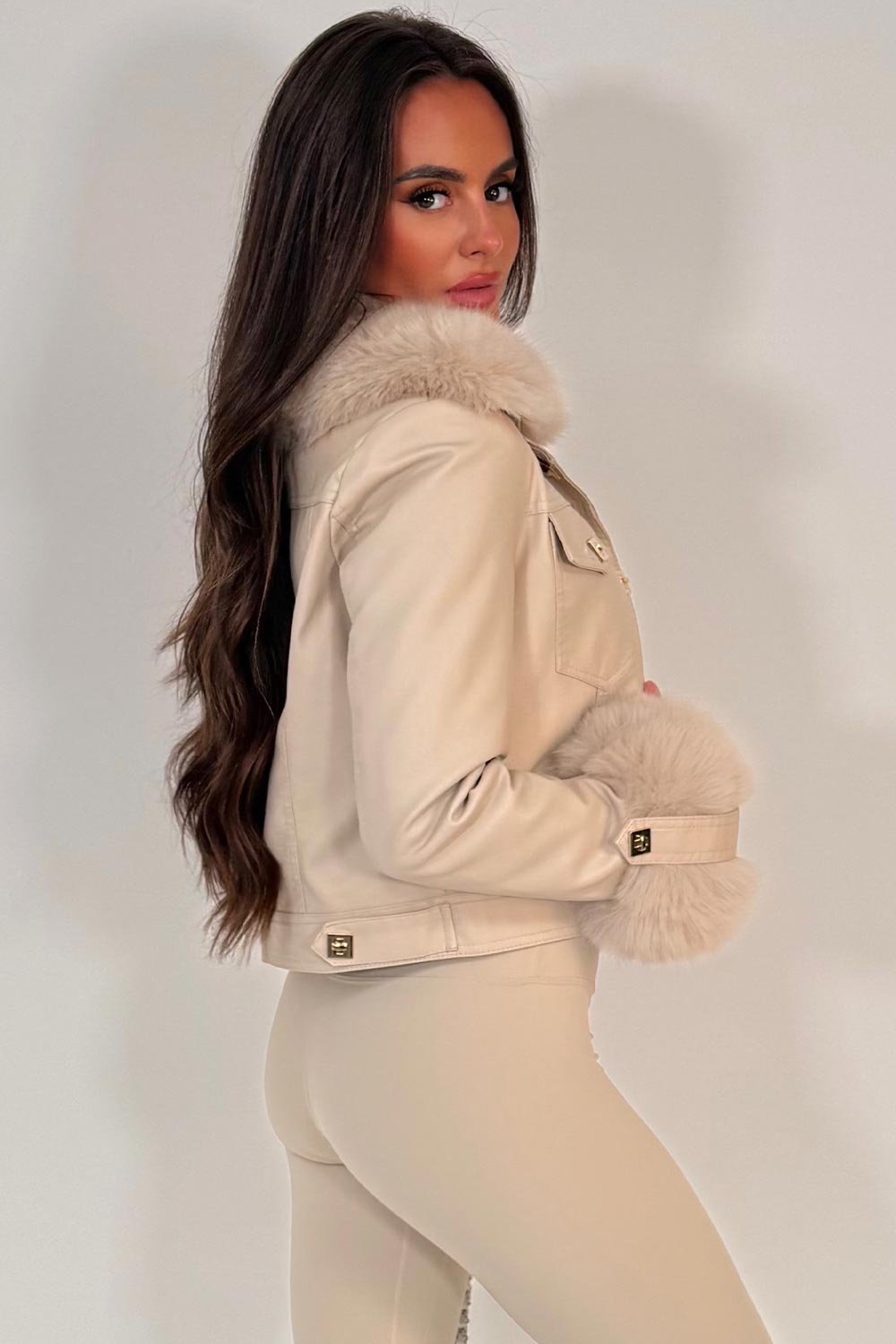 gold button faux leather bomber jacket with faux fur cuff and faux fur collar styled up womens christmas market outerwear 