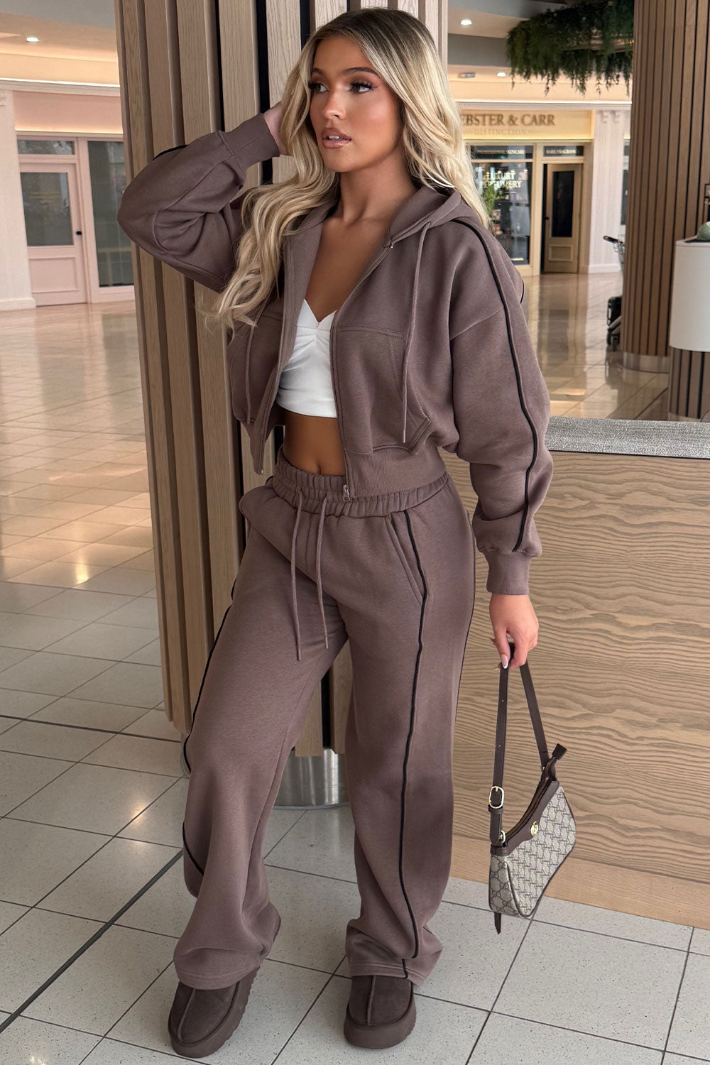 womens crop hoodie and joggers tracksuit set airport outfit styledup