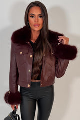 womens fur cuff and collar faux leather jacket with gold buttons styled up