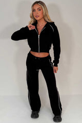 womens black crop hoodie and joggers tracksuit set airport outfit styledup