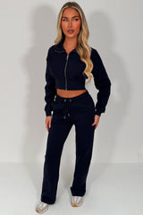 womens navy crop sweatshirt and wide leg joggers tracksuit airport outfit casual everyday outfit styledup uk
