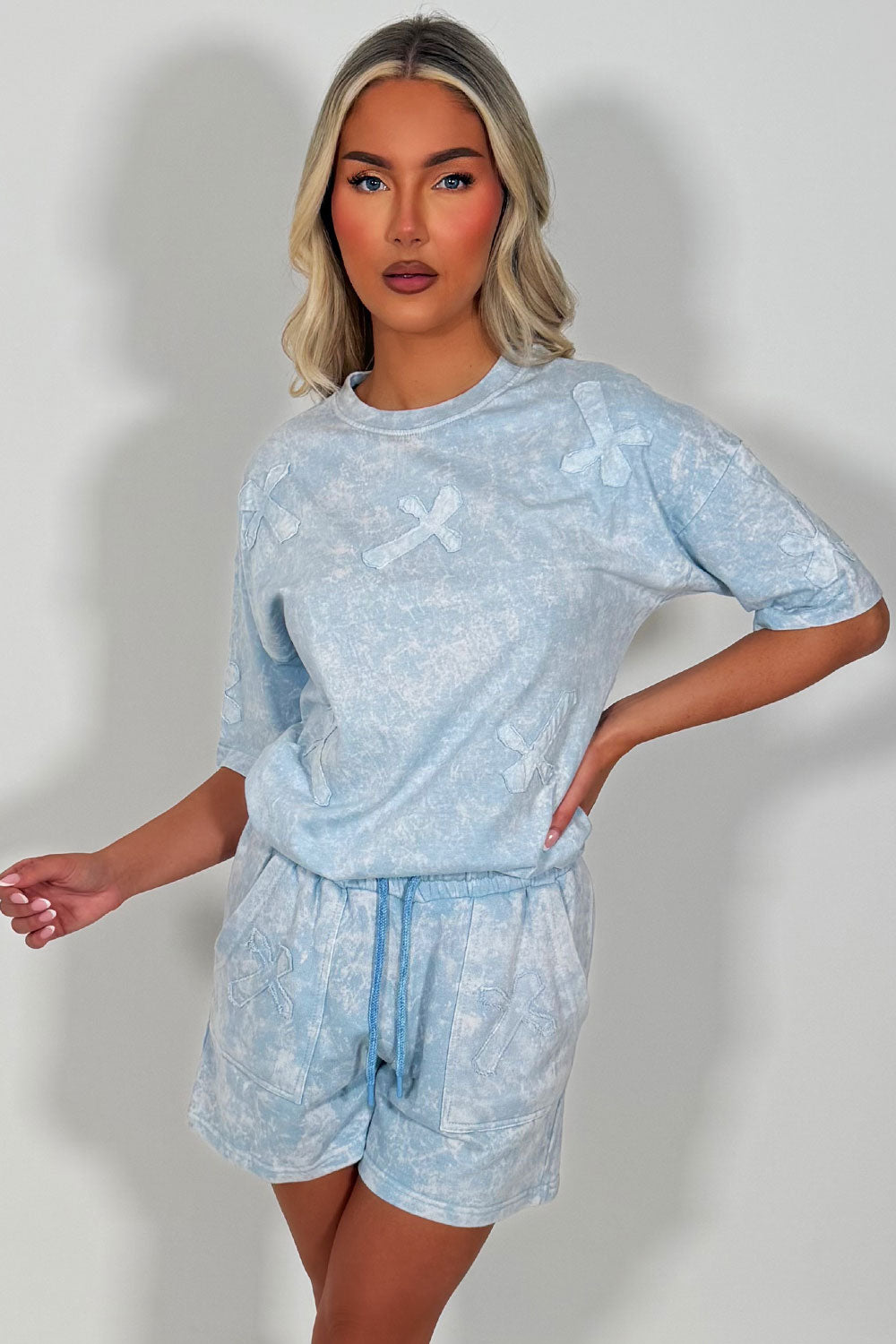 shorts and t shirt summer outfit for womens with cross applique sky blue acid wash styledup