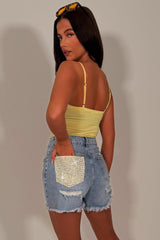 denim blue shorts with contrast yellow pocket diamante rhinestone applique womens