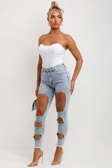 womens light wash denim ripped skinny jeans with diamante detail