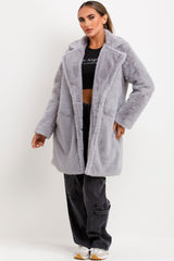 fur coat with belt and button fastening for womens