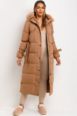 longline padded puffer coat with fur hood and waist belt camel 