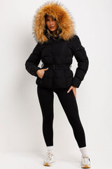 womens winter coat with faux fur hood styled up 