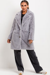 faux fur coat with belt and button fastening grey