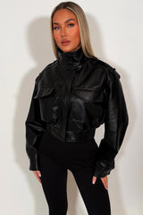 womens black faux leather jacket with shoulder tabs long cuffed sleeves front pockets with flaps elasticated hem zip up front hidden by a placket with snap buttons zara uk styledup 