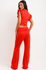 womens frill ruffle sleeve top and skinny flare trousers with fold details