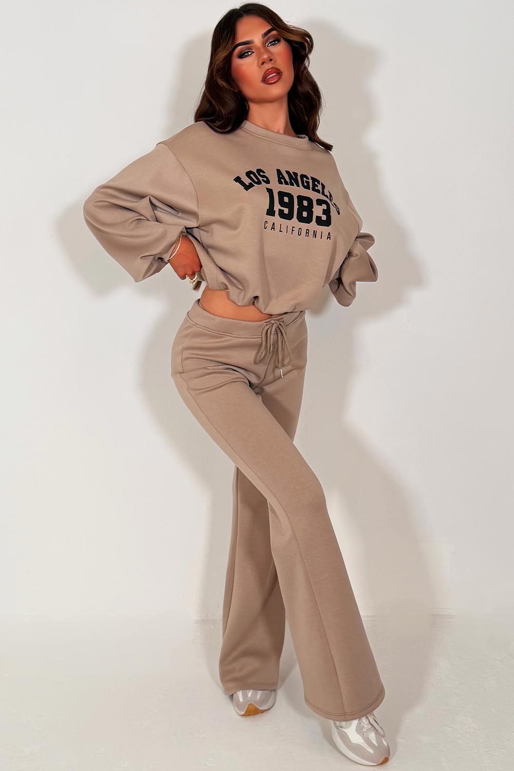 womens los angeles california slogan oversized crop sweatshirt and flare trouser two piece co ord set beige styledup 