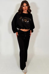 womens los angeles california slogan oversized crop sweatshirt and flare trouser two piece co ord set black styledup 