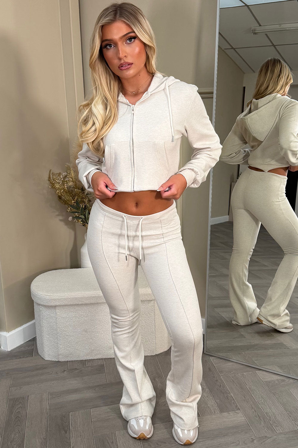 interlock sweatshirt and bell bottom top stitched trousers two piece loungewear set 