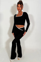 womens v waist flared yoga pants and long sleeve top two piece co ord set styled up 