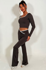 womens v waist flared yoga pants and long sleeve top two piece co ord set styled up 