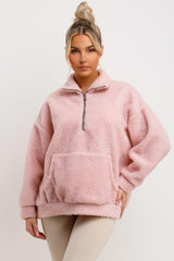 pink half zip kangaroo pocket sweatshirt