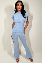 fold over flare trousers and occasion top two piece set with shoulder pad going out summer occasion outfit