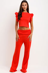 skinny flare fold detail trousers and ruffle frill sleeve top two piece co ord set airport outfit