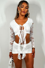 white lace mini festival skirt and long sleeve frilly tie front crop top co ord set summer holiday going out outfit