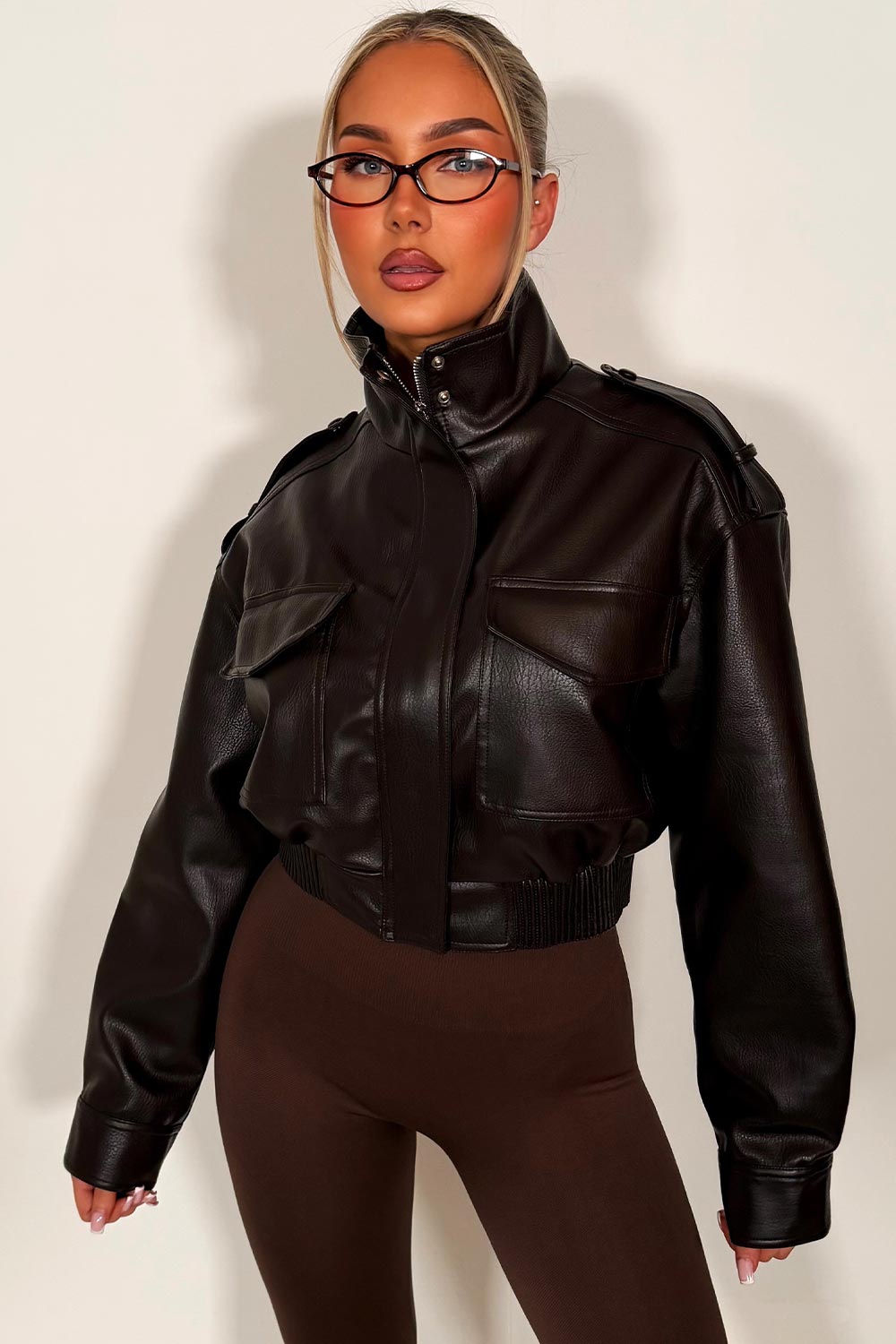 womens brown faux leather short jacket with high collar long sleeves shoulder tabs pockets on front zip fastening zara uk styledup 