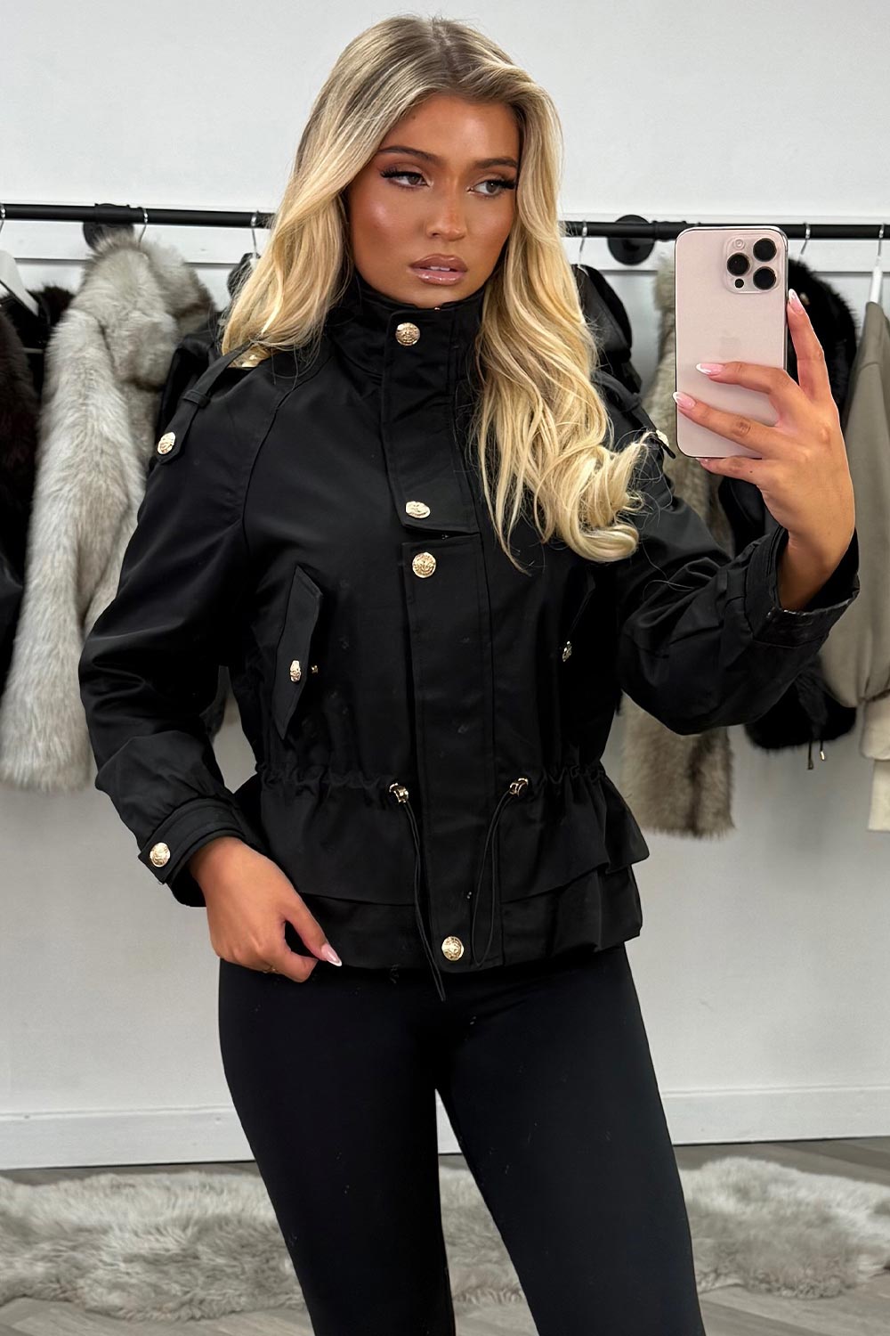 womens black funnel neck jacket with gold buttons and adjustable drawstring cinched waist 