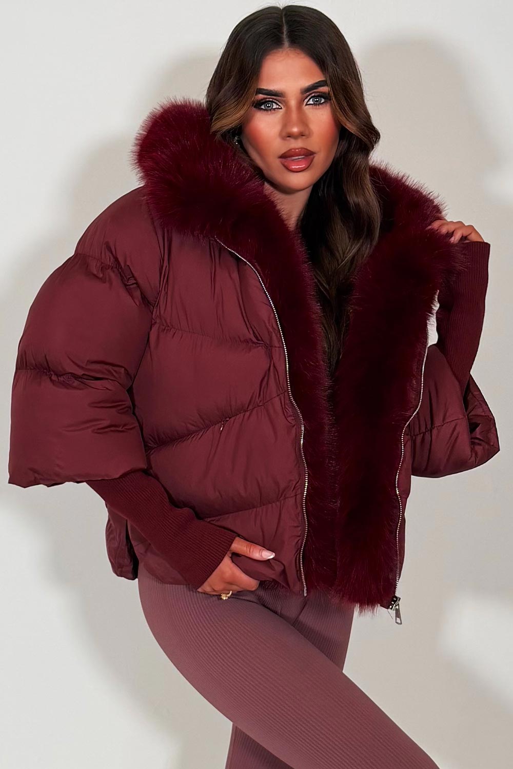 faux fur hood puffer jacket with faux fur trim on the front burgundy styledup womens outerwear 