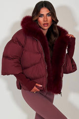 faux fur hood puffer jacket with faux fur trim on the front burgundy styledup womens outerwear 
