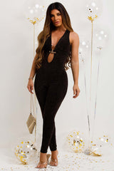 black sequin jumpsuit with gold buckle